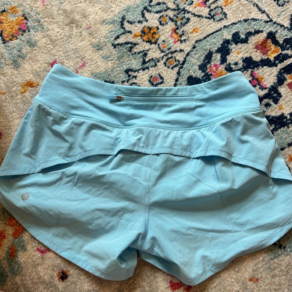 Lululemon speed up mid-rise lined 4” shorts in chill blue.